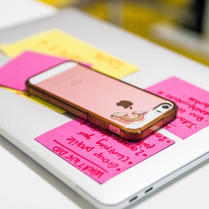 phone and laptop with sticky notes