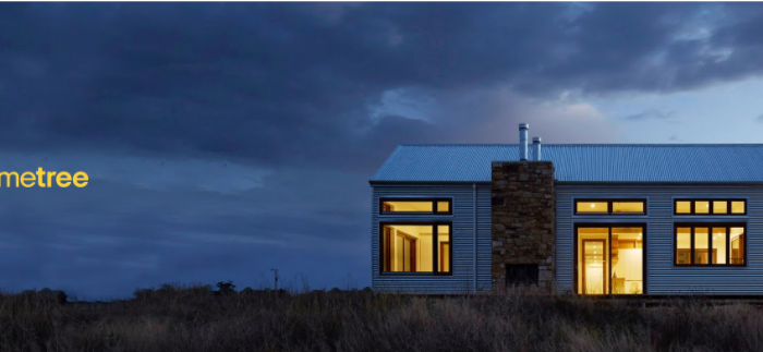 exterior view of a home at night with warm lighting